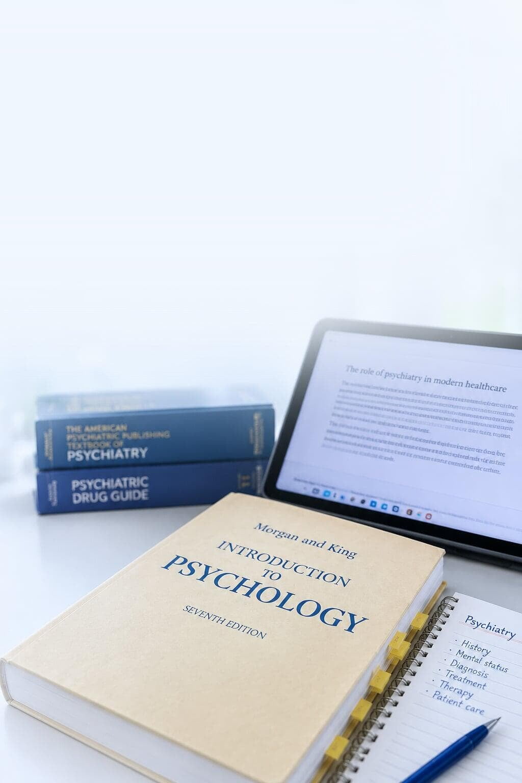 Psychiatry study desk with textbooks and notes